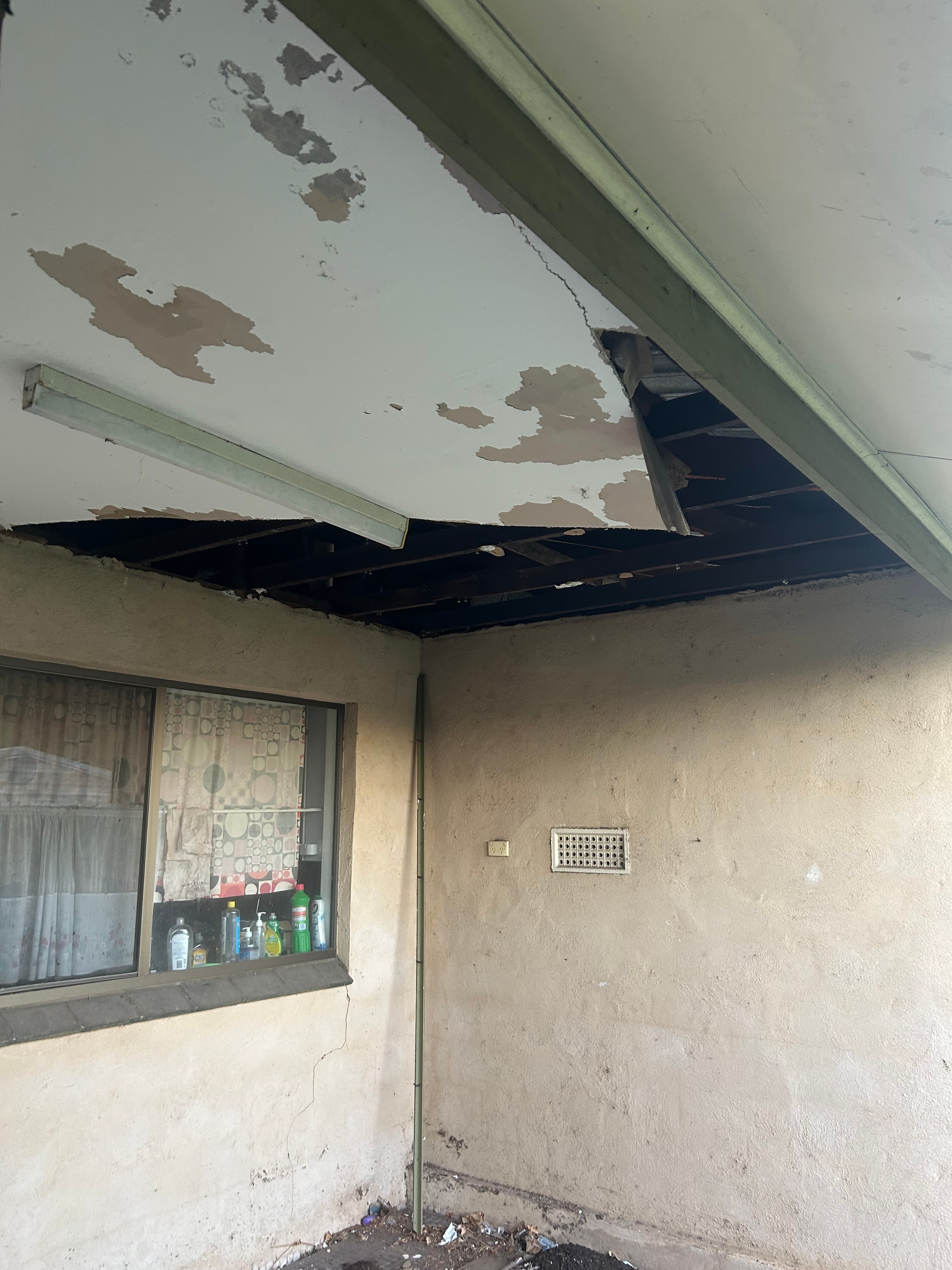 Water-damaged ceiling before replacement